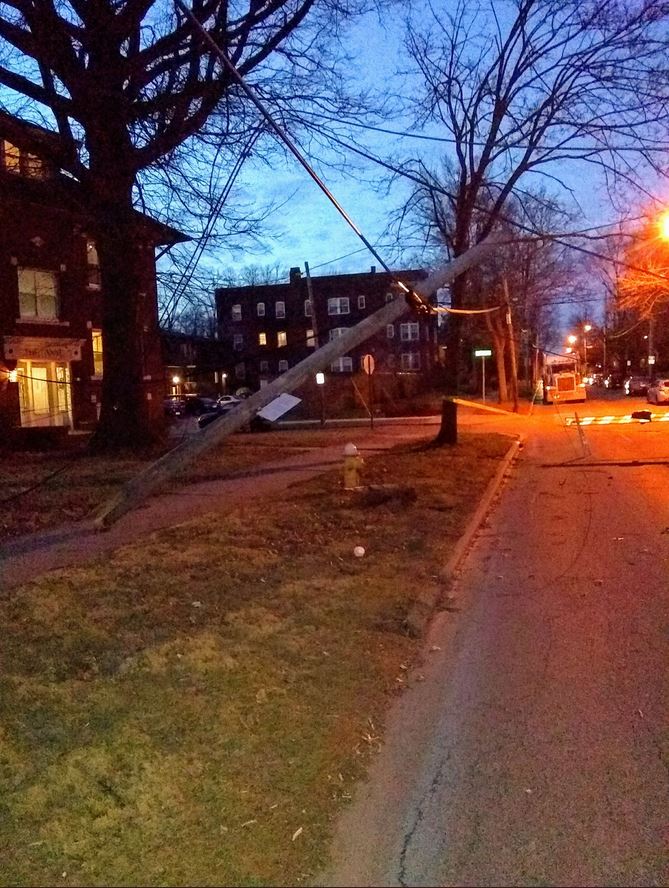 Power pole snapped with wires hanging
