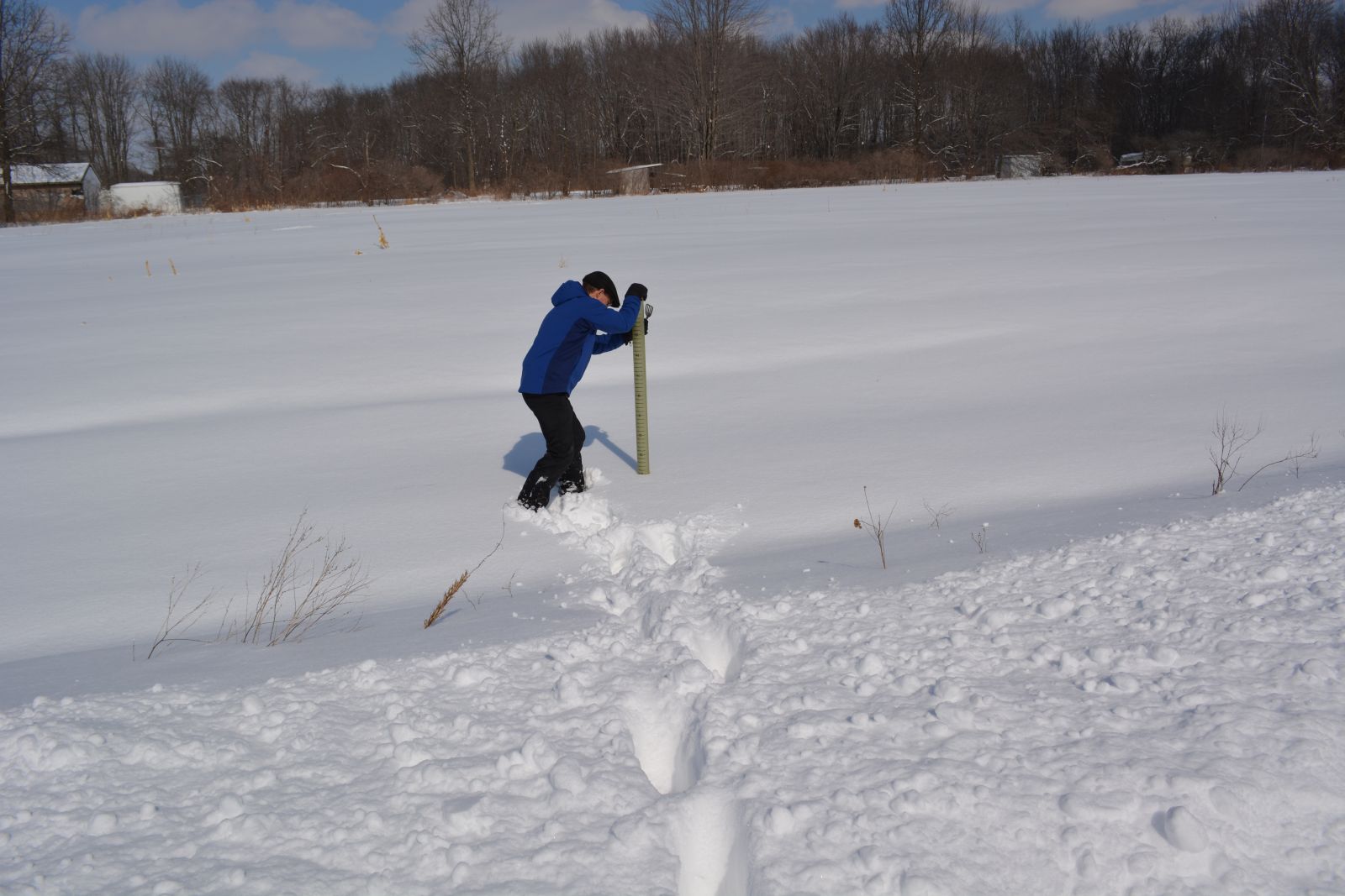 snow core being taking by a NWS CLE employee