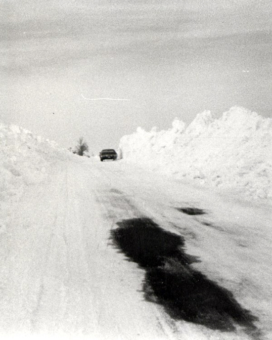 piles of snow along a road