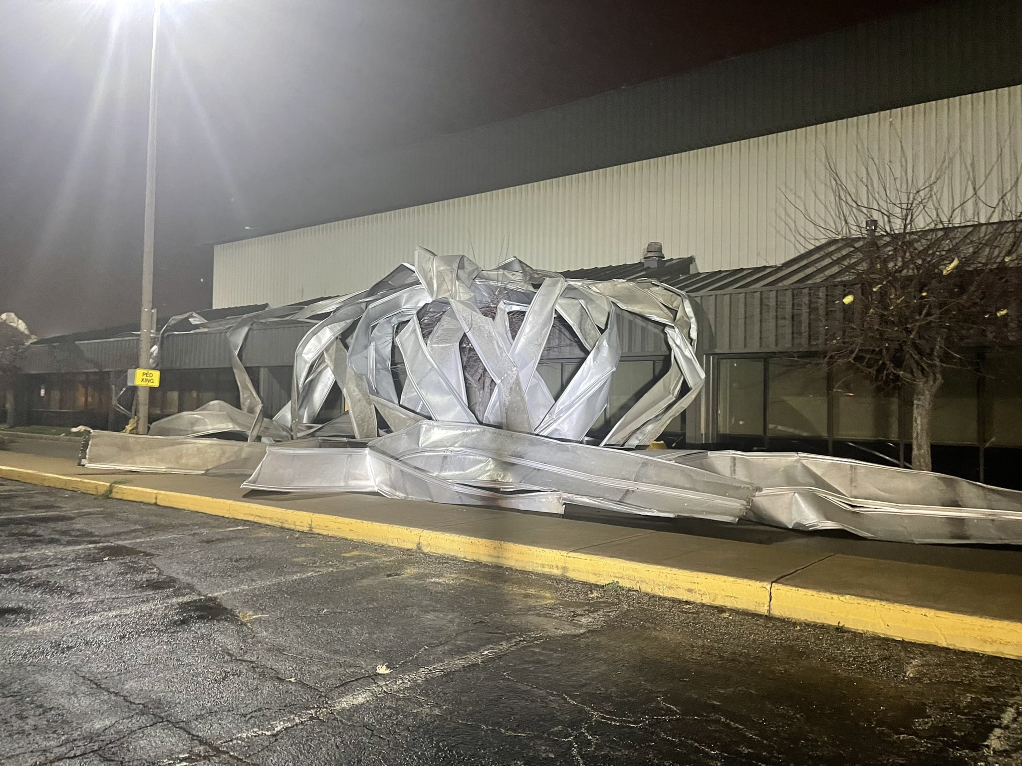Photo of roof damage an airport building at Kansas City Downtown Airport