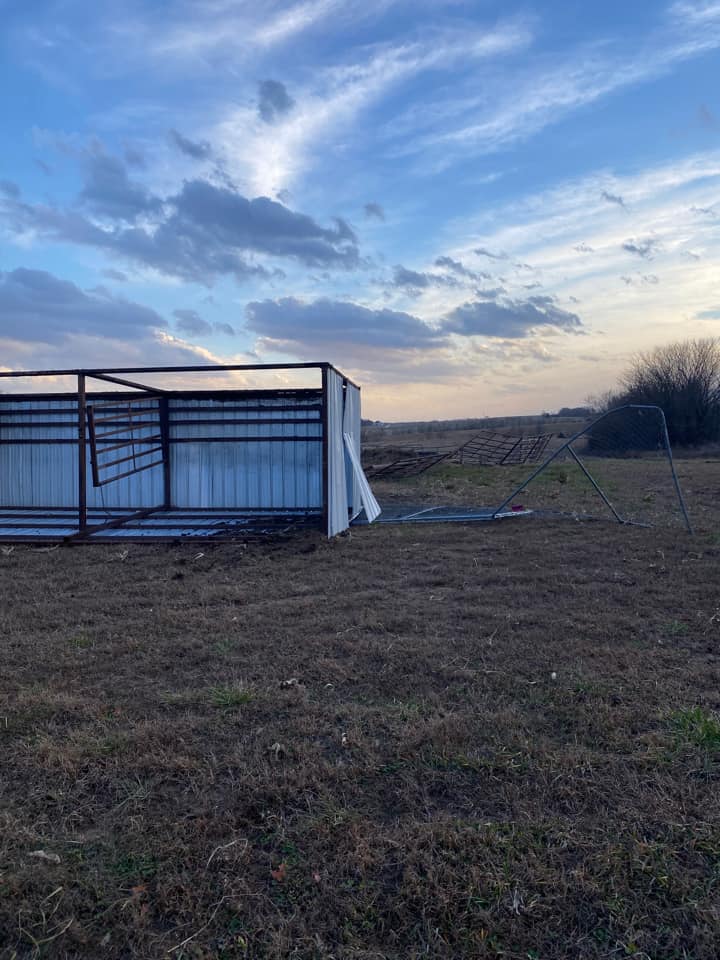 Photo of metal shed damaged by high winds ahead of thunderstorms.