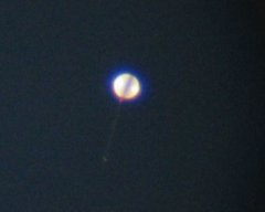 [ Weather Balloon as seen through a telescope - as the balloon rises it increases in size.]