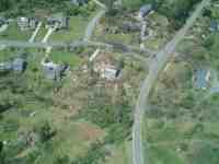 [ Aerial photo of damage along Governor MacDonald - Pineworth Rd. ]