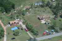  [ Aerial view of damage to homes and trees. ]