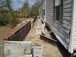 [ Manufactured Home Removed from its Foundation. ]