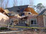 [ House severely damaged in River Oaks Subdivision ]