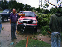 [ another angle of truck damaged by tornado spawned by Ivan ]