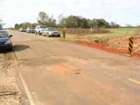 [ road patched after tornado ripped up asphalt ]