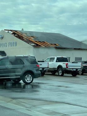Tornado Damage, Roof ripped off of Ford dealership in Park Rapids