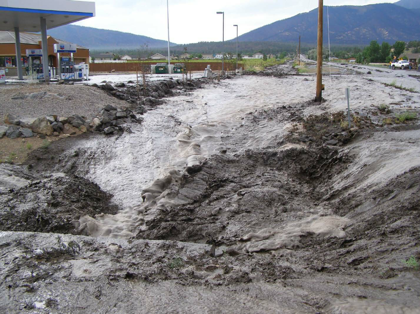 Flood waters inundating the intersection of Campbell Ave and U.S. Hwy 89.