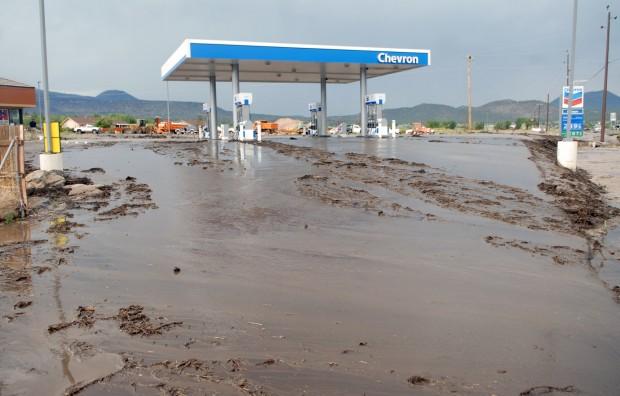 Flood waters and debris flows transported mud to the Chevron located at the intersection of U.S. Hwy 89 and Campbell Ave.