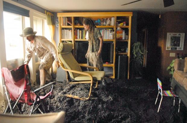 Debris and mud was forced into a house from the flooding.