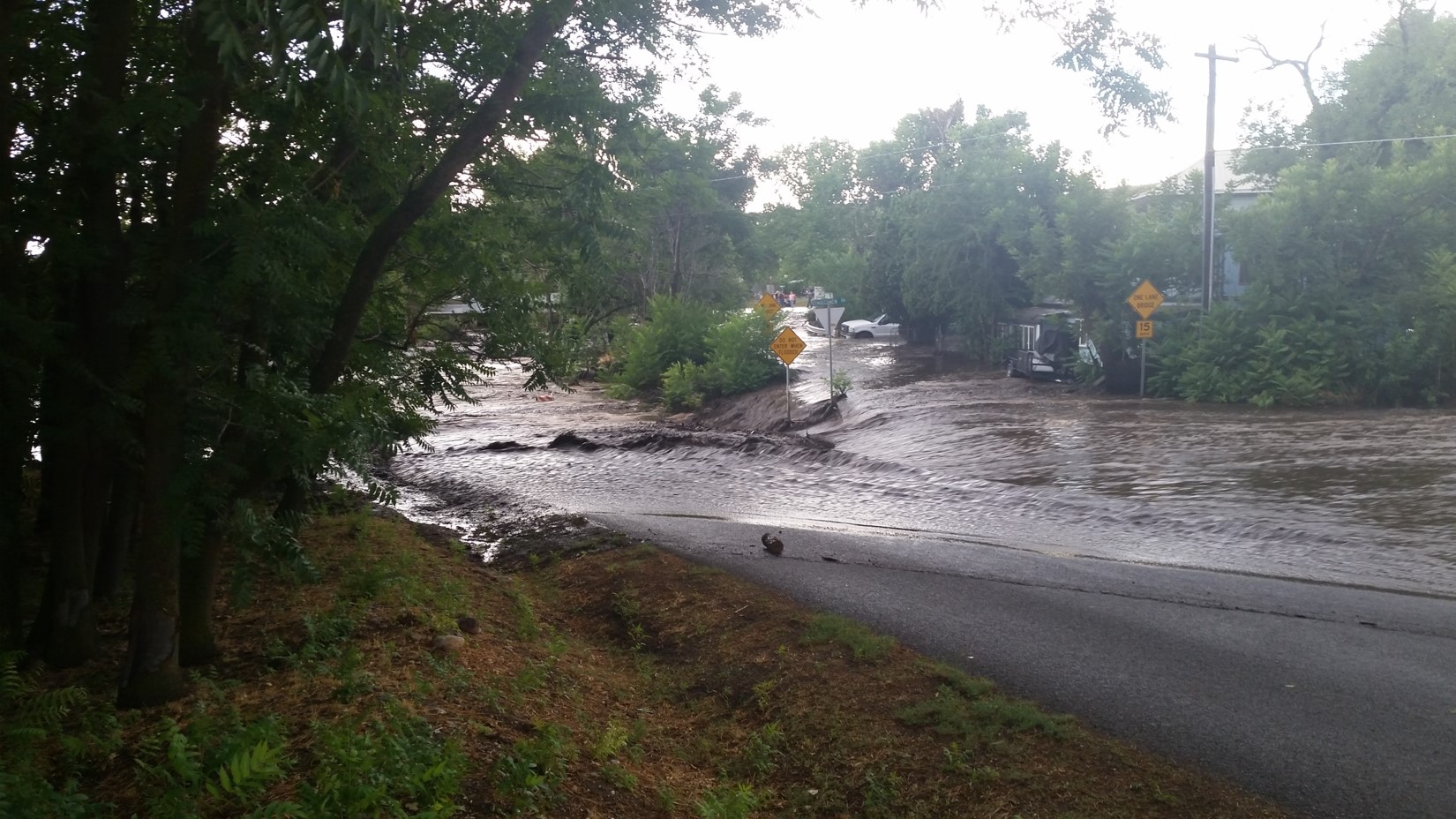 Low water crossing of Big Bug Creek over Central Avenue in Mayer during the 19 July 2017 event. This crossing is barricaded during most flow events off the Goodwin scar. On 19 July, the water came out of the established channel and affected a number of homes.