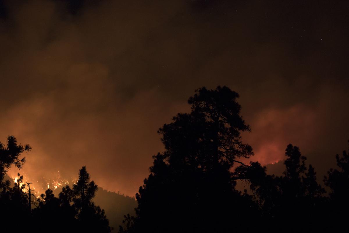 Flames visible at night from the Museum Fire.