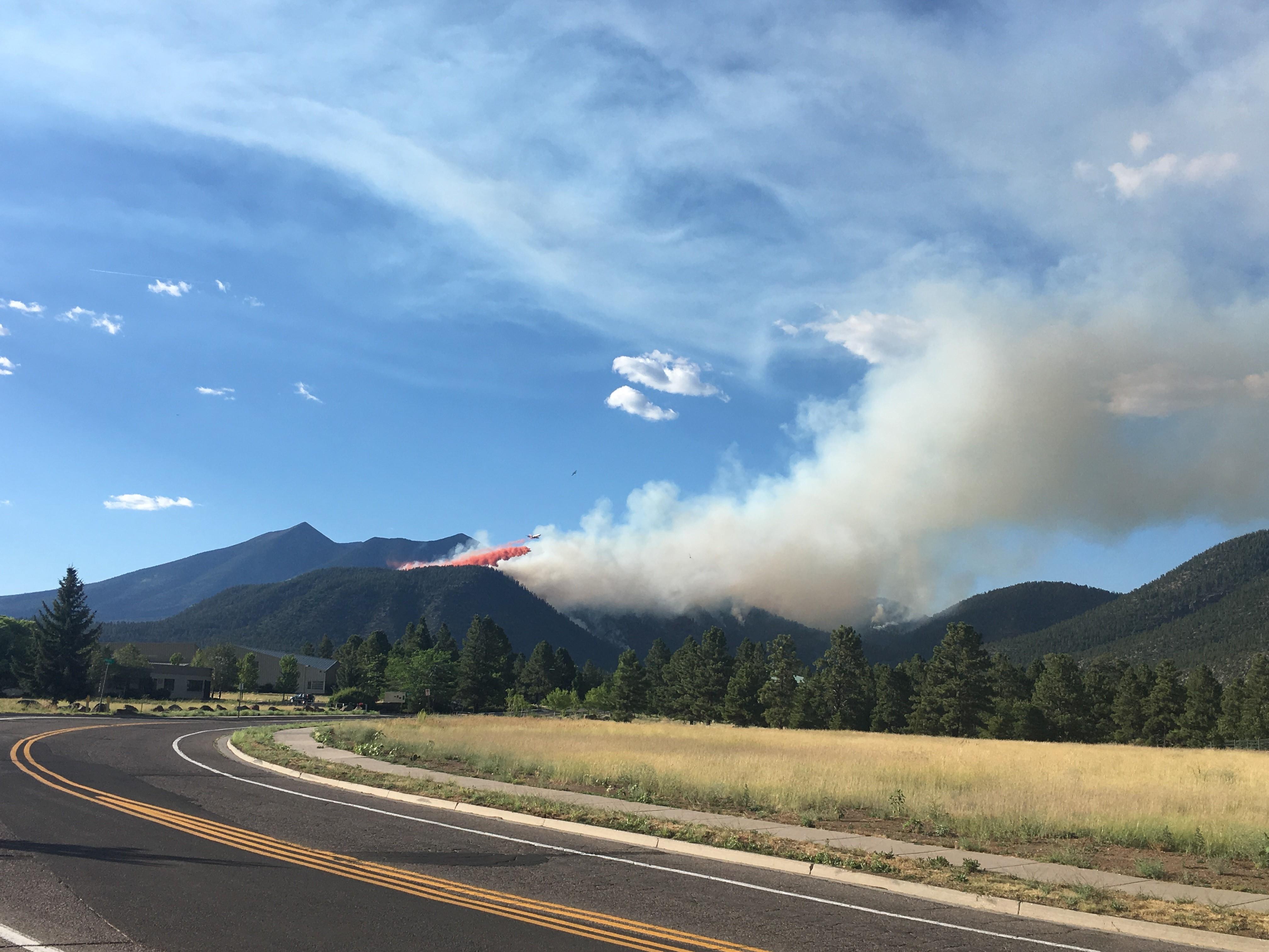 View of flames and smoke generated by the Museum Fire flames as seen along Hwy 180.