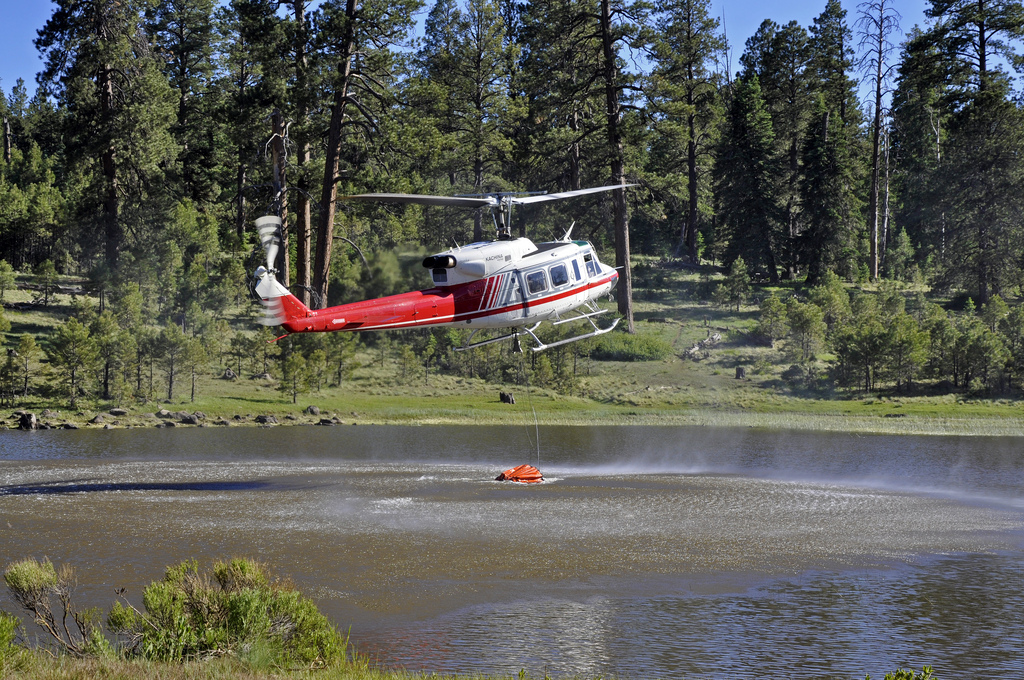 Helicopter picking up water that will be used for the Schultz Fire containment effort. Photo credit: USDA Forest Service, Coconino National Forest