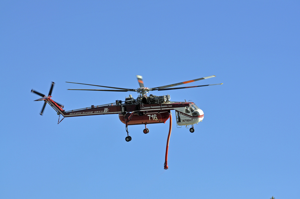 Flying helicopter used to help contain the Schultz Fire. Photo credit: USDA Forest Service, Coconino National Forest