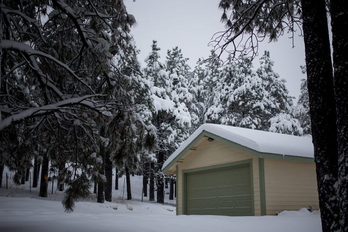 16-19 inches of snow fell across the Flagstaff area early Friday morning through early Saturday. Photo Credit: The Republic