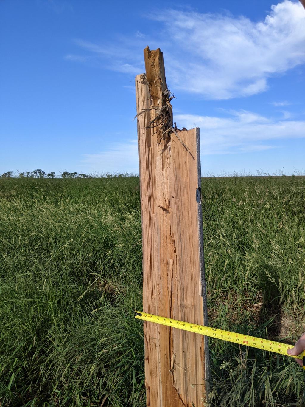 Power pole snapped by brief tornado north of Iroquois in far eastern Beadle County.