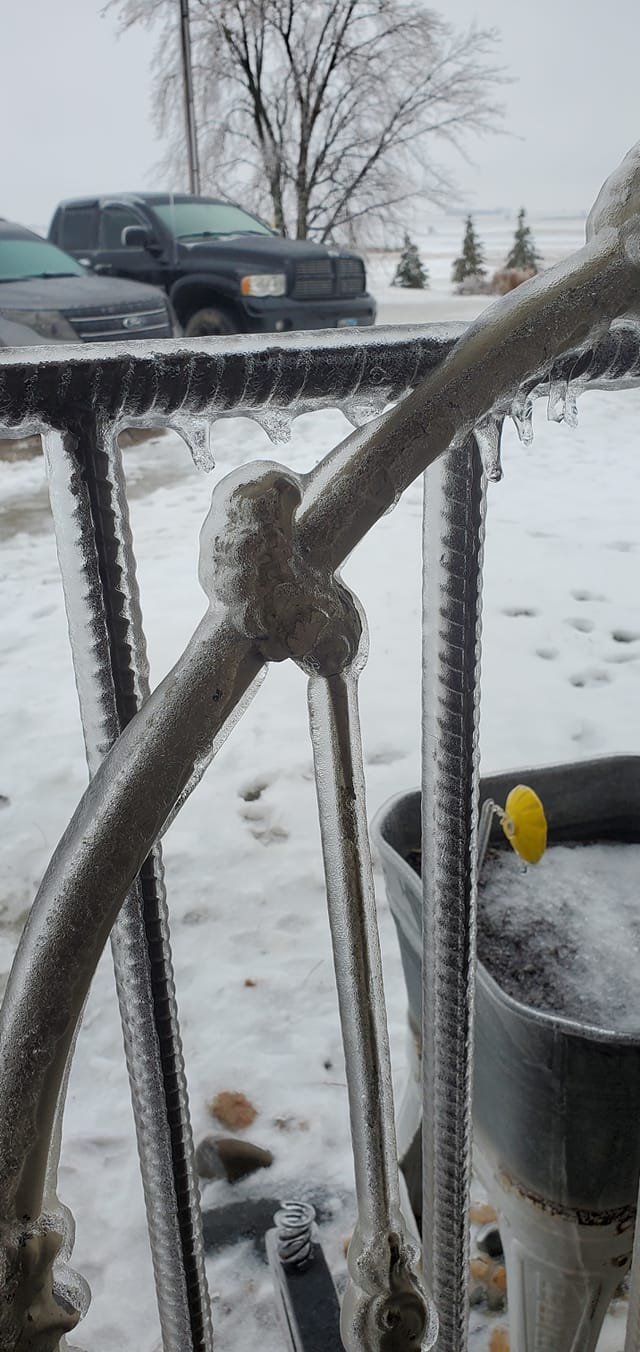 Ice coated metal railing.
