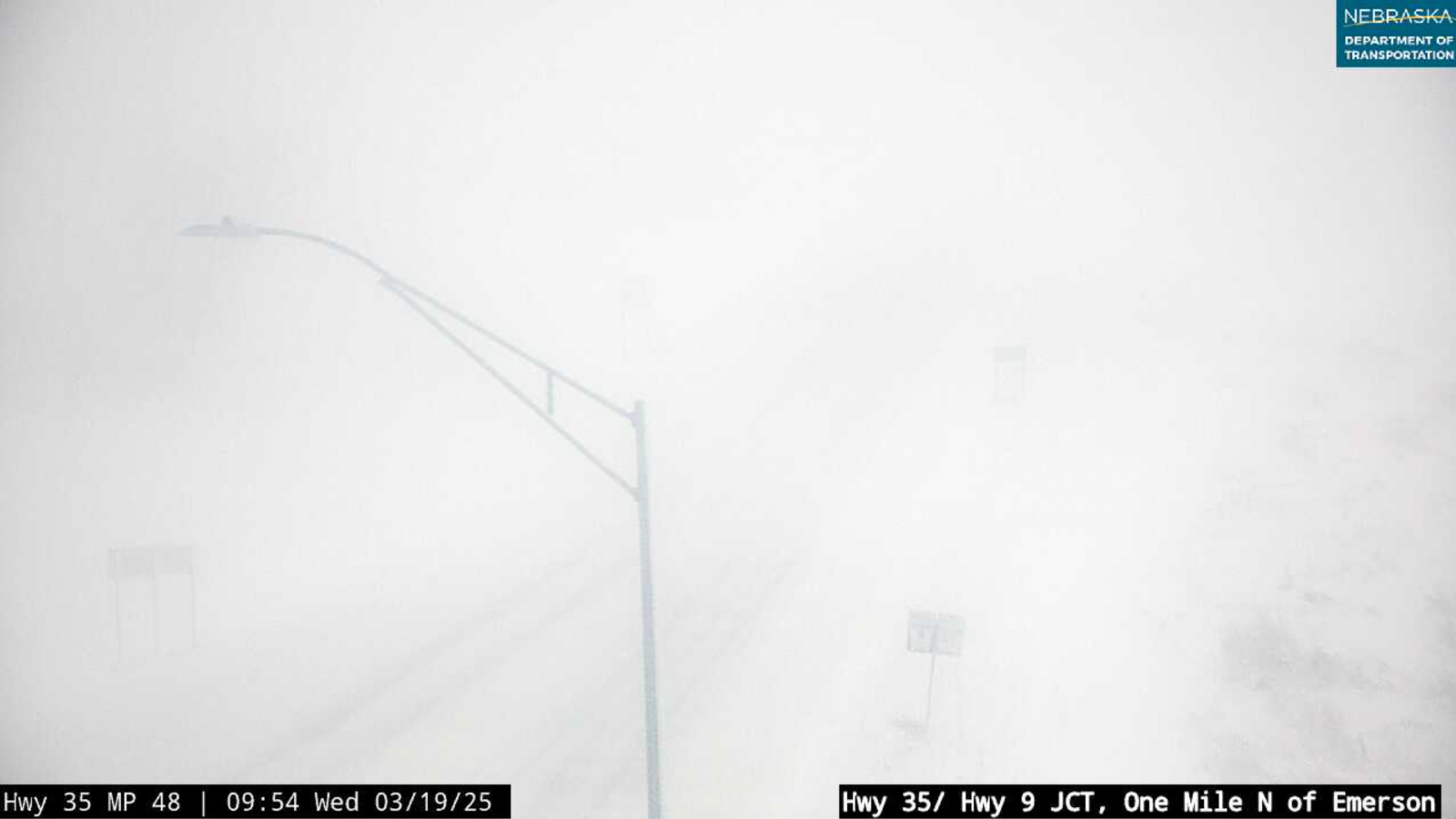 Photo of greatly reduced visibility due to falling and blowing snow.