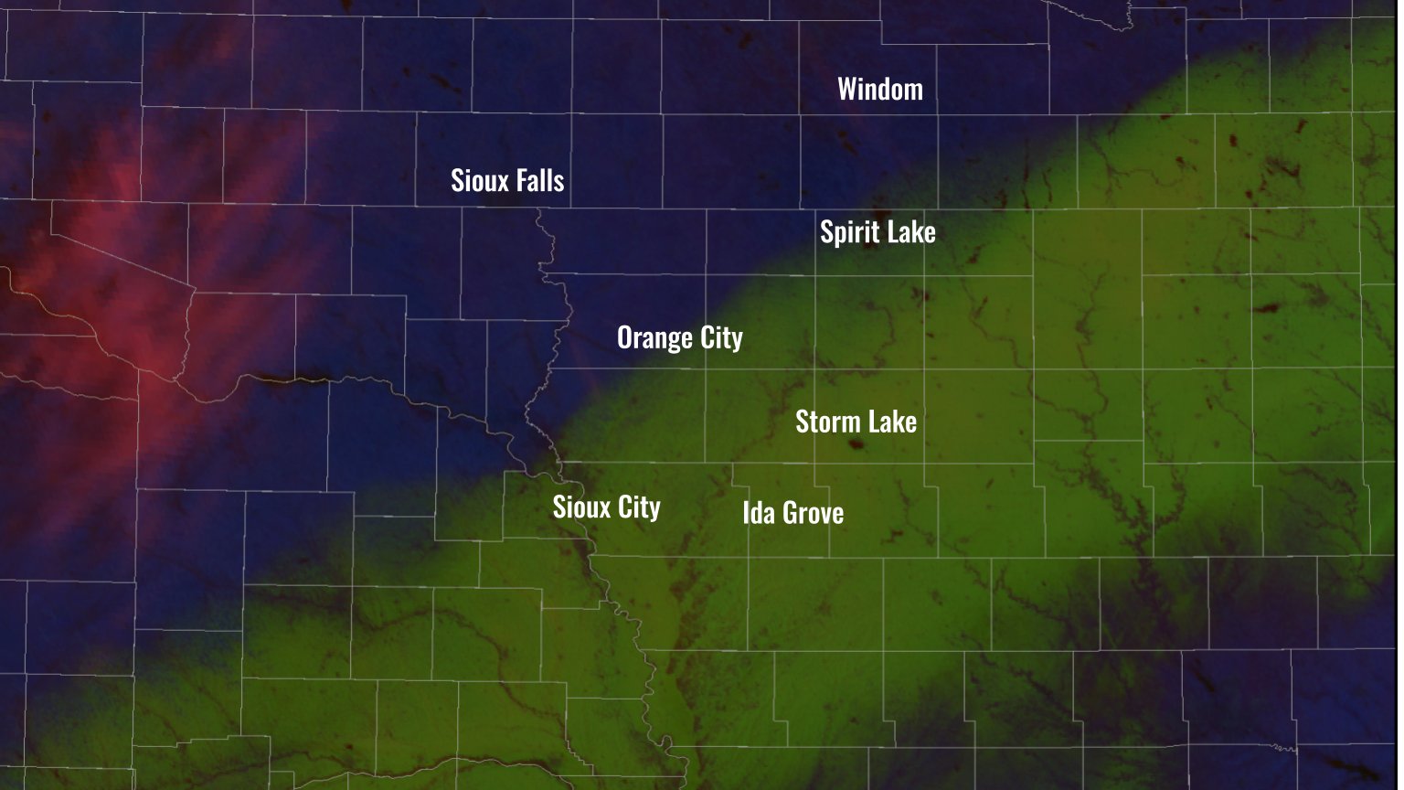 GOES East image shows a swath of snow cover in green near and south of a Sioux City to Spirit Lake line.