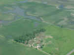 Aerial view of damaged farmstead east of Davis.