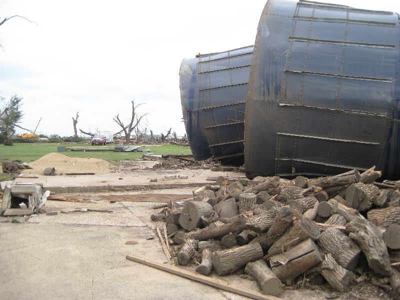 Picture of two toppled silos and the concrete slab they were anchored to.
