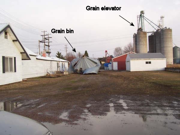 Grain bin blown from grain elevator to alley
