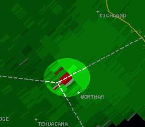 Reflectivity image (left) and velocity image (right) of the tornadic storm southwest of Richland, near the Freestone County line, at 7:35 am. In the velocity image, red indicates motion away from the radar in Fort Worth, and green indicates motion toward the radar.