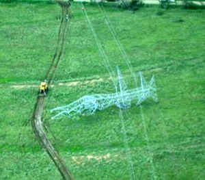 Damage to metal transmission line towers 1/2 mile west of Interstate 45: