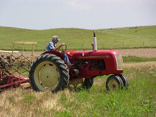 Mr. Roach on the Tractor