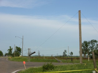 Power poles snapped in half near Elm Creek, Nebraska. Photo by NWS Staff. 
