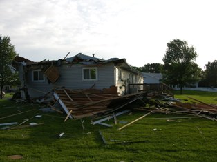 Roof blown off of residence in Elm Creek. Photo by NWS Staff.
