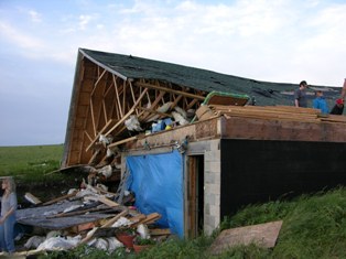 Roof blown completely off of house. Photo by NWS Staff.