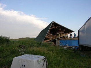 Another view of roof blown off of house. Photo by NWS Staff. 