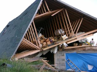Roof from house destroyed by tornado. Photo by NWS Staff. 