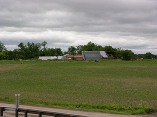 Debris thrown into a field. Photo by NWS Staff.