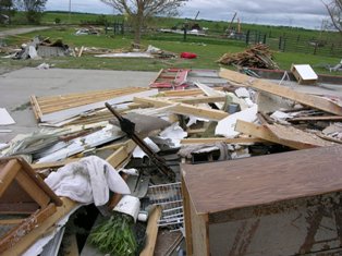Debris scattered across yard. Photo by NWS Staff.