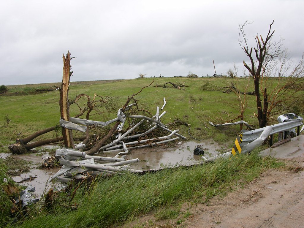 Irrigation pipe twisted around a tree north of Hampton. Photo by NWS Staff.