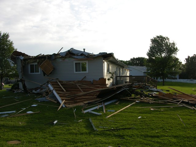 House roof and outbuilding destroyed in Elm Creek. Photo by NWS staff.