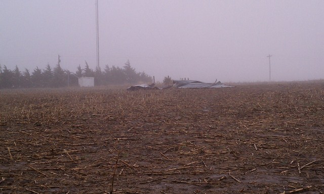Debris blown across a field of a grain bin destroyed near Oxford, Nebraska. Photo taken by NWS Staff. 
