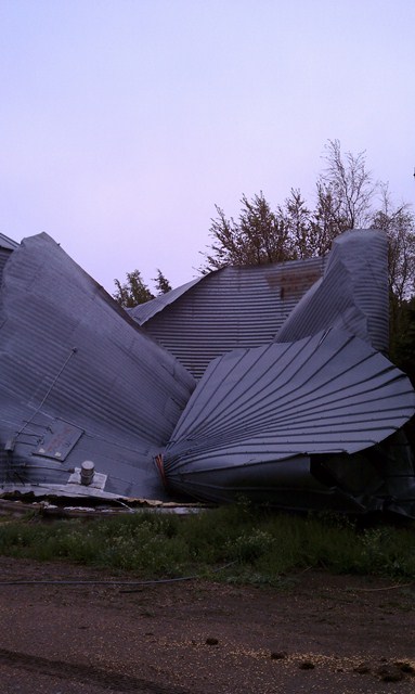 Debris blown across a field of a grain bin destroyed near Oxford, Nebraska. Photo taken by NWS Staff. 