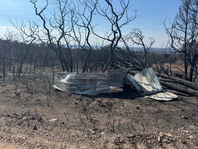 Fire damage with debris from tornado