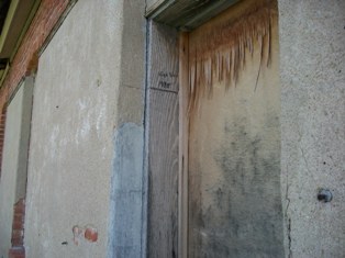 Close up of Door on Old Light and Power Building in Arapahoe, NE with High Water Mark Close up of Door on Old Light and Power Building in Arapahoe, NE with High Water Mark