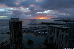 Sunset over Barber's Point, Oahu from Waikiki Beach (photo by Mandolin Davis)