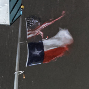 An image of a US and Texas flag from the Galveston County Office of Emergency Management as Nicholas made landfall.
