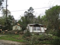 Not one, but two trees fell on this mobile home, essentially destroying it. Amazingly, two people who were taking cover in this mobile home when the trees fell on it were not injured.
