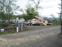 Numerous camper trailers were damaged by falling trees, and some were blown into the nearby lake.