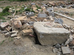 Another view of the remains of the stone-built home on Skaggs Rd.  Notice the large piece of concrete foundation that was pulled out of the ground. 